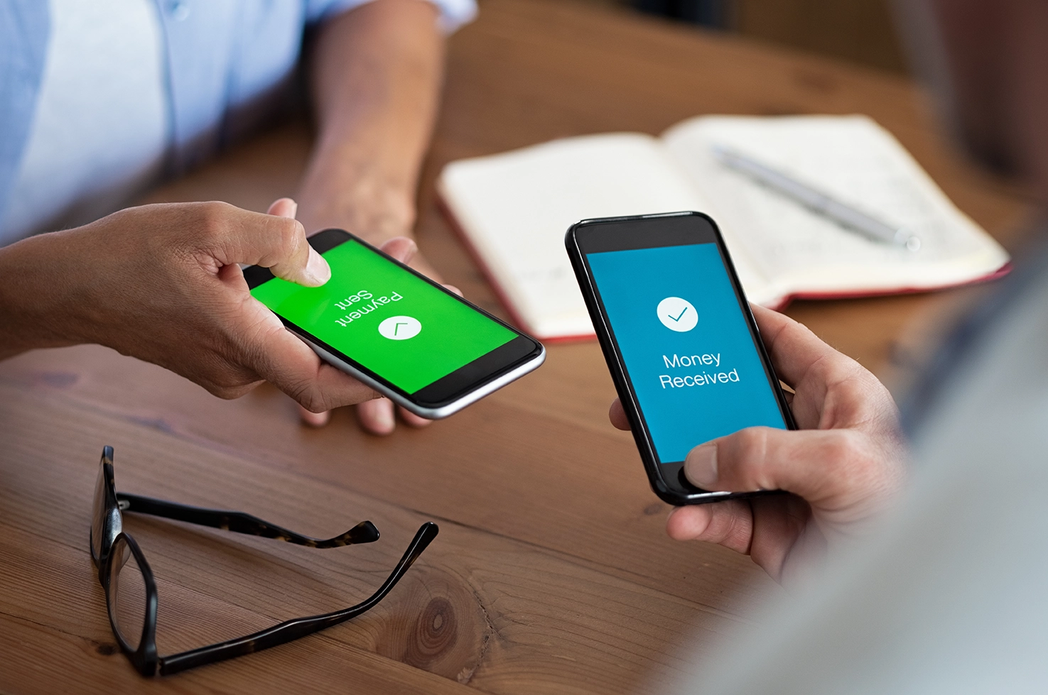 two phones sending payment information